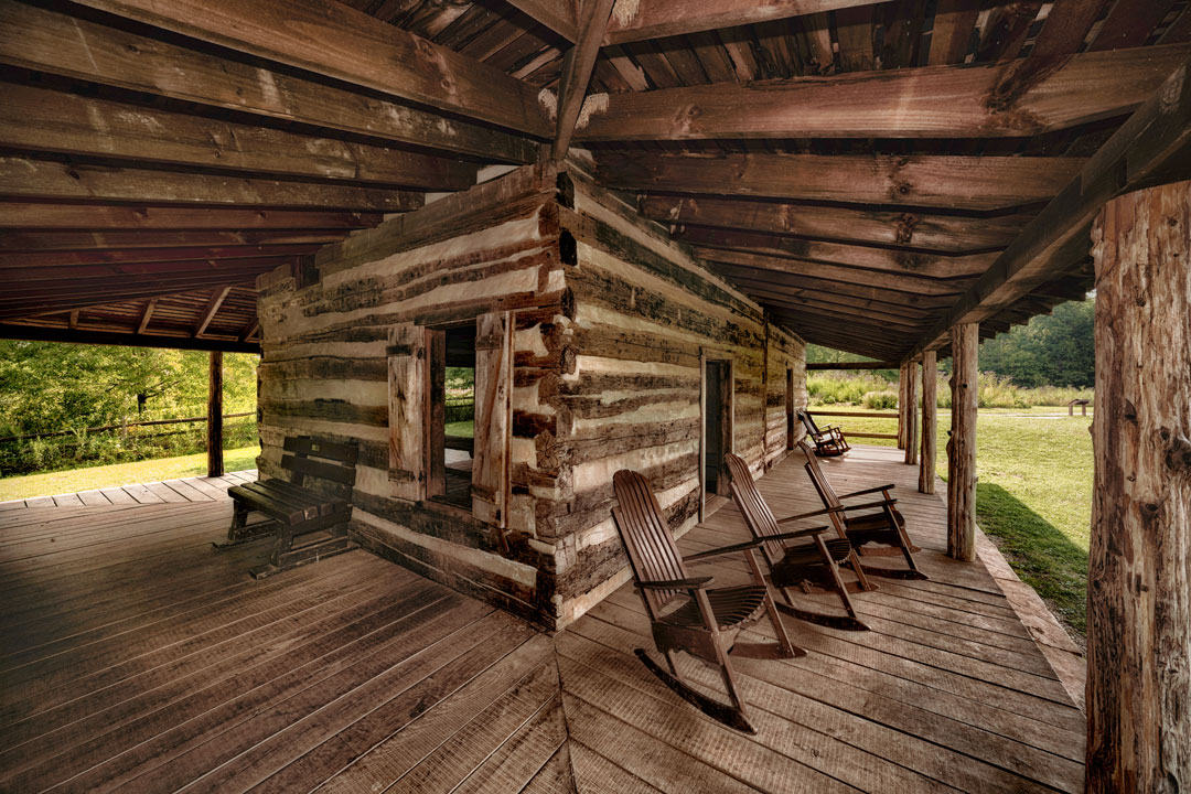 A wide angle lens view of the corner of a log cabin